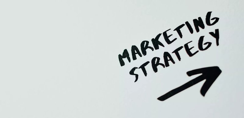 marketing strategy written on a grey background